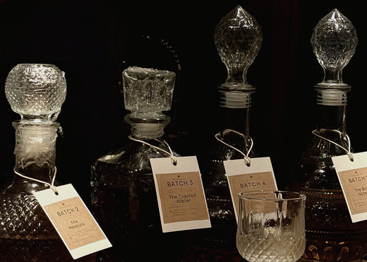 The evening's expressions, side by side. Each decanter holds a different chapter of the same story.